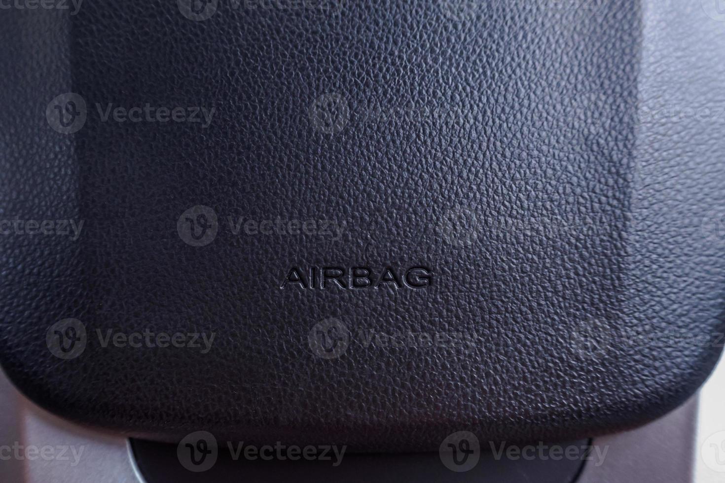 Airbag sign on car steering wheel photo