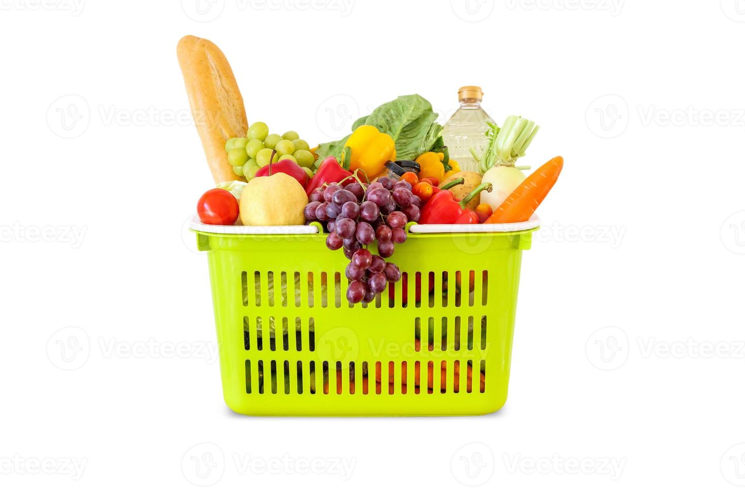 Fresh fruits and vegetables grocery product in green shopping basket isolated on white background photo