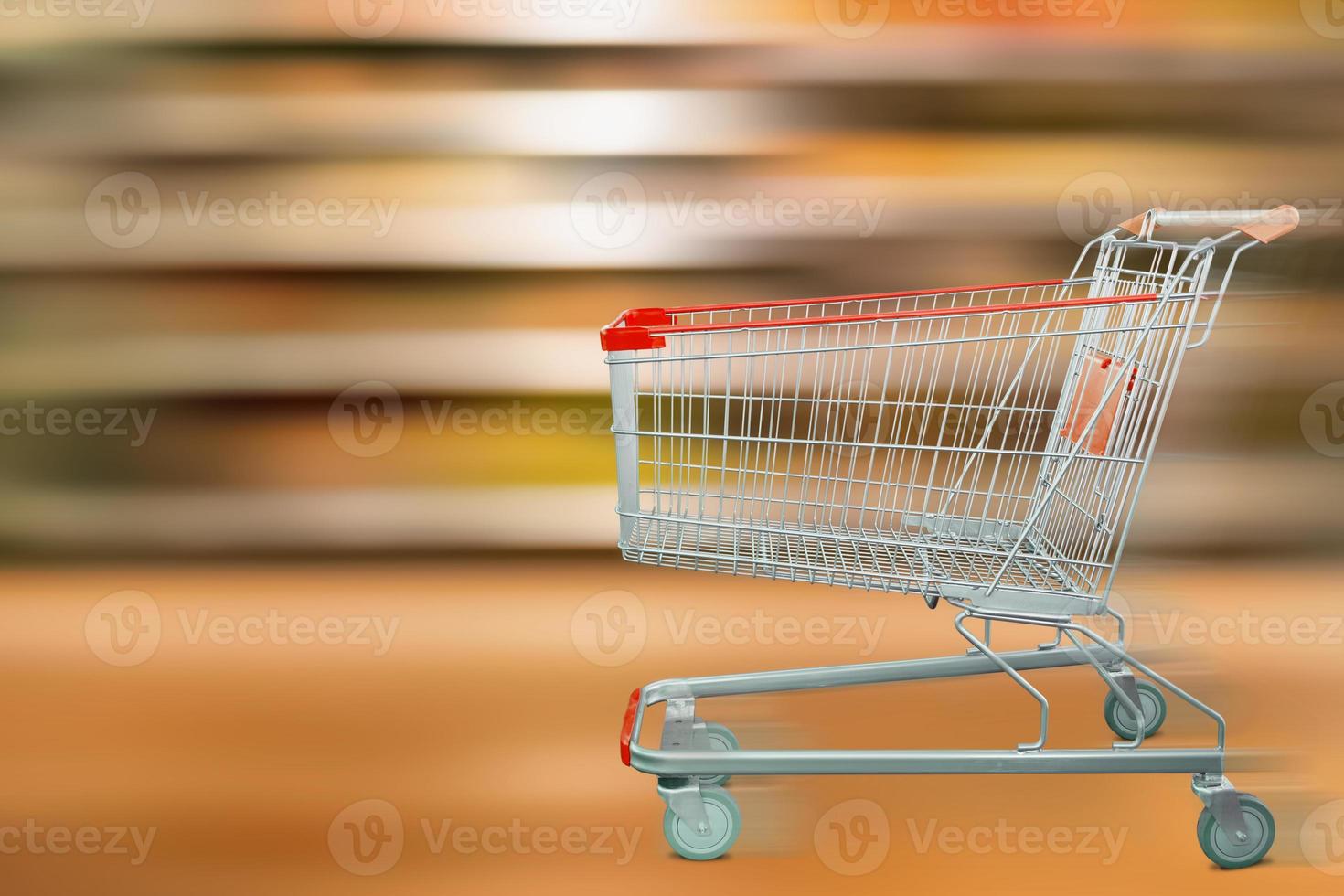 supermarket shelves motion blur with shopping cart photo