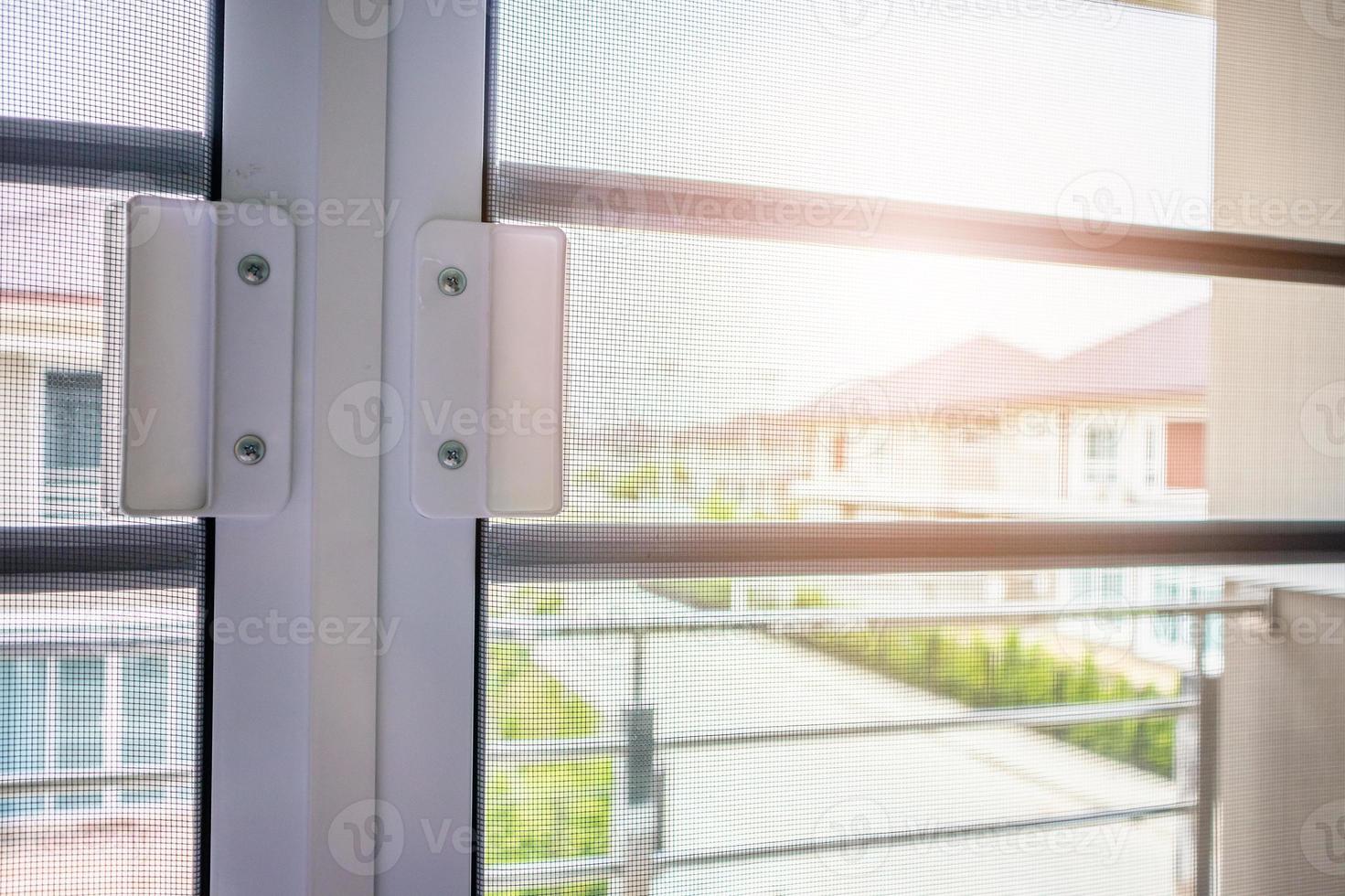 mosquito net wire screen on house window protection against insect photo