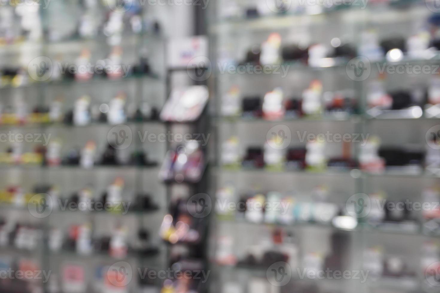 digital cameras and lenses in store shelf blur background photo