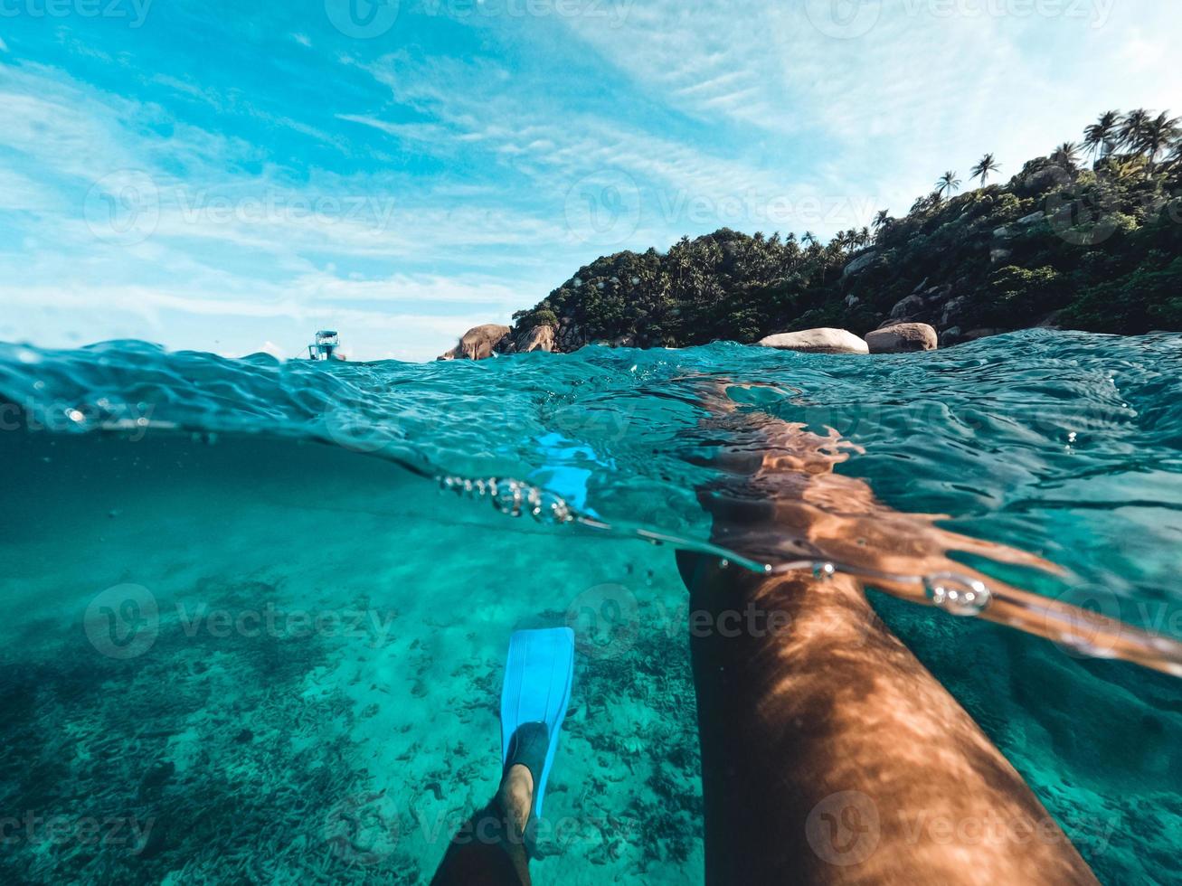 Snorkeling in the sea on a tropical island photo