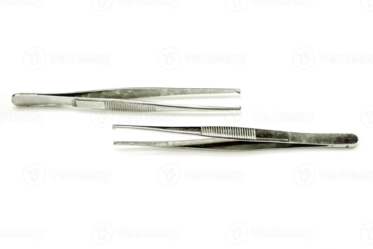 Medical tweezers isolate on white background. photo