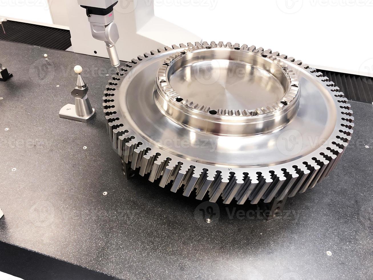 Large shiny spare part, engine, turbine, gear, stainless steel part