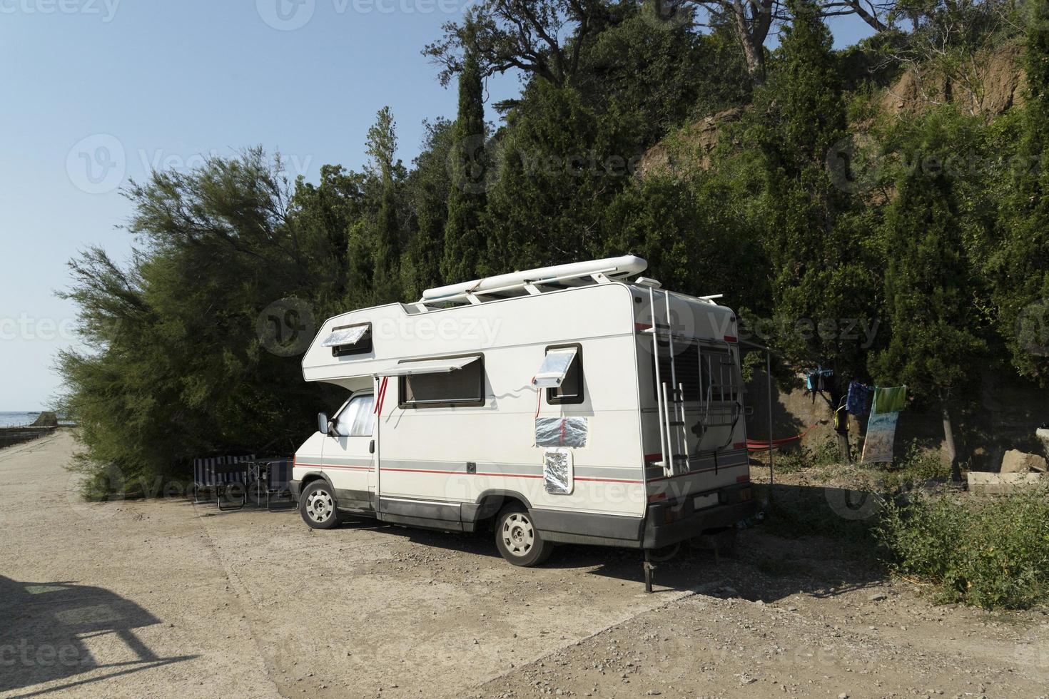 Motorhome on wheels van, van, people, travel trip, adventure. pit stop in a rented car. photo