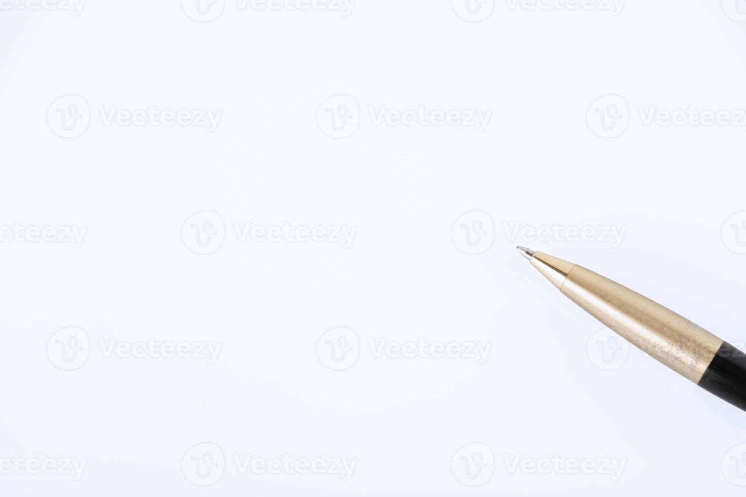 pen made of yellow and black metal alloy lies on the desktop. Close-up. Business background, business idea, signing documents. copy space. photo
