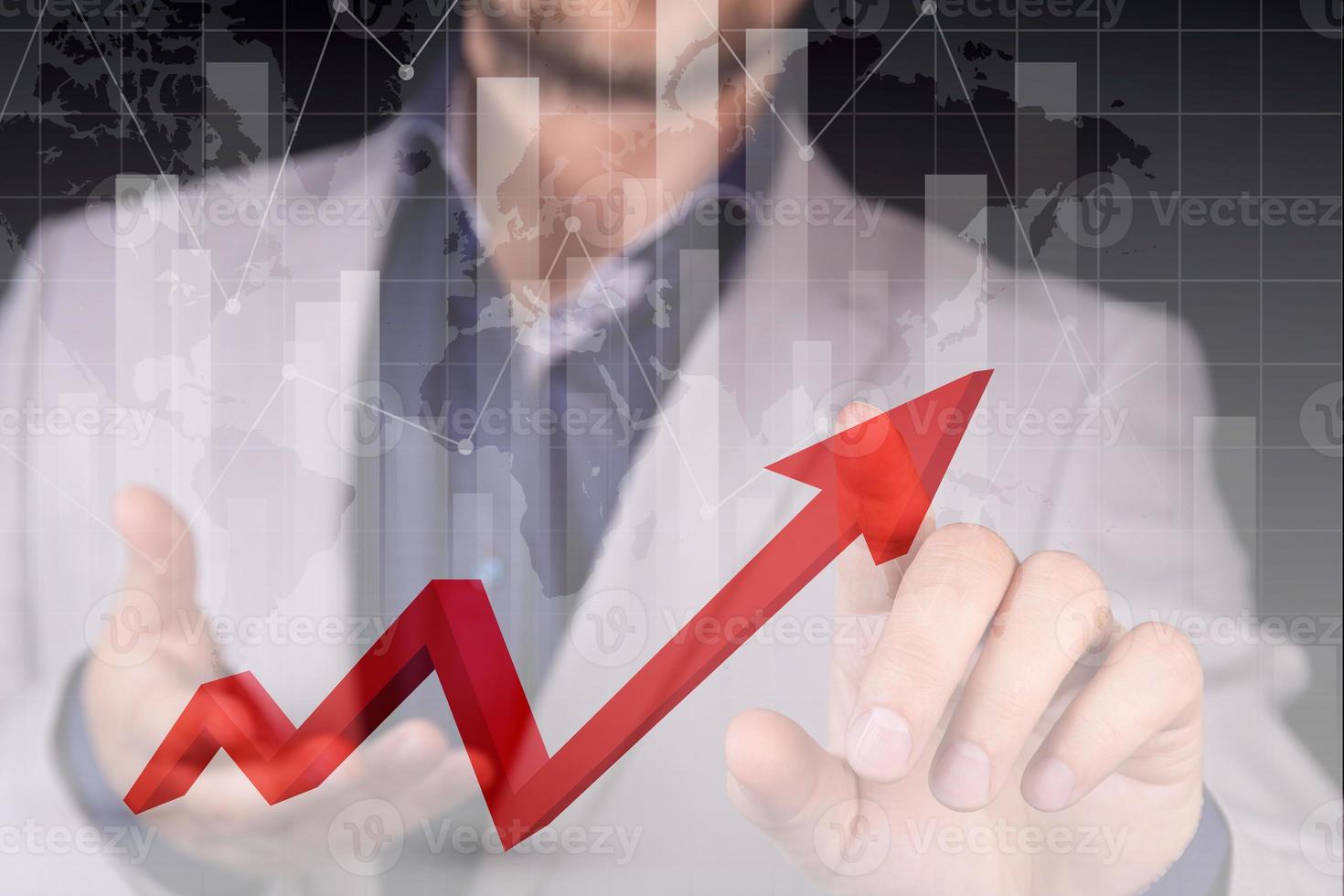 Stock market growth graph, manipulations with forex, the hand of a businessman indicates a red graph of growth and profit, a red danger zone against the background of the world map. Double exposure. photo