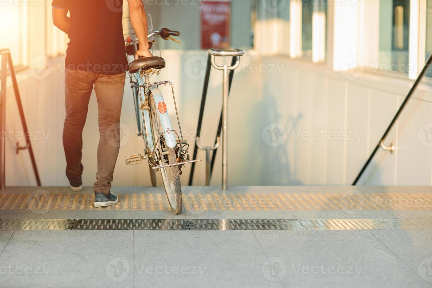 modern lifestyle of urban people using bring bicycles go with subway underground train station in car free day. photo