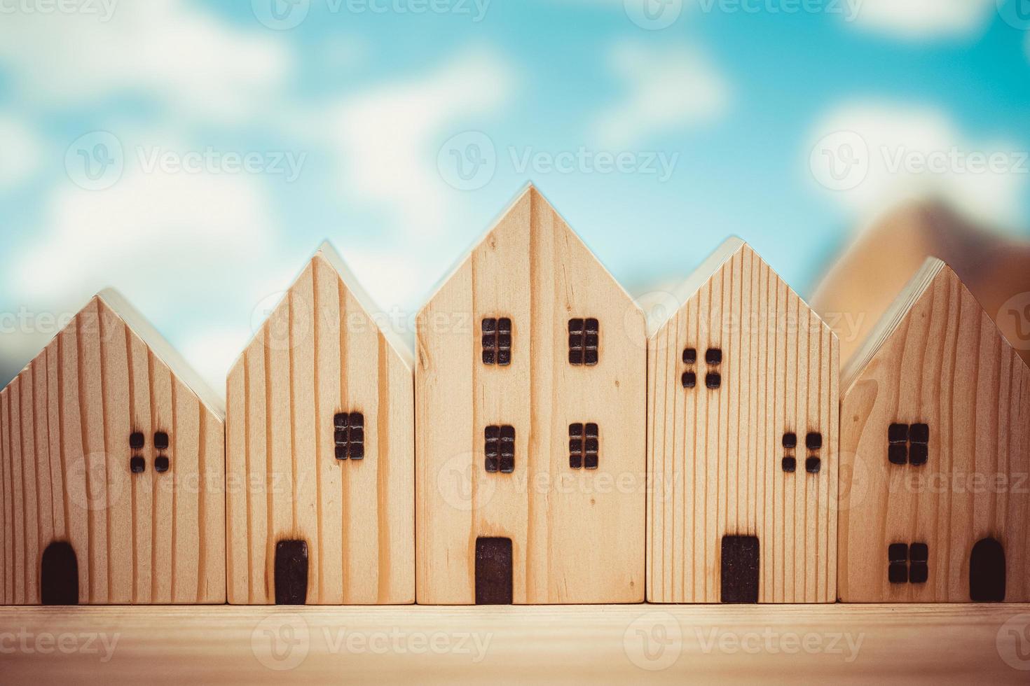 wooden home model toy many house row community art decoration for background vintage colortone. photo