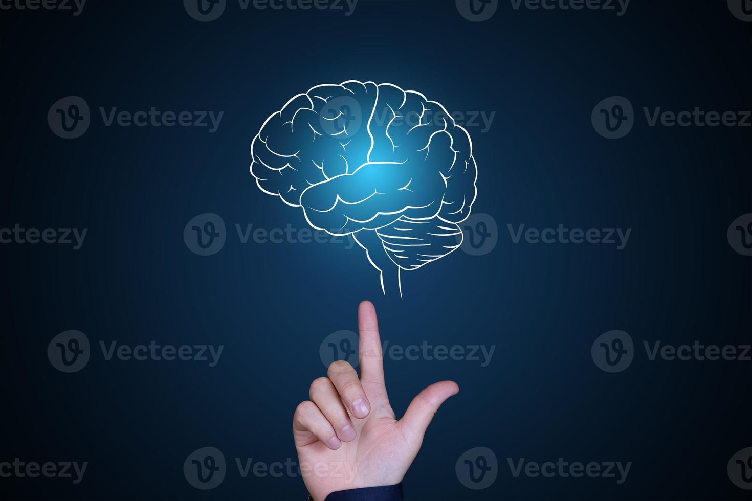 Human brain in neon glow. The hand points to the brain. Human psychology, artificial intelligence, brainstorming, thinking concept. Copy space. photo