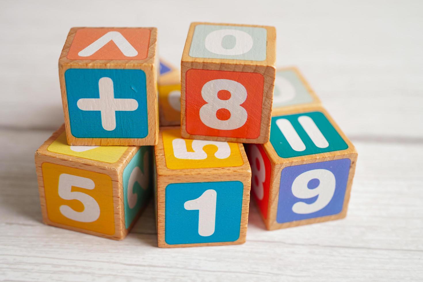 Number wood block cubes for learning Mathematic, education math concept. photo