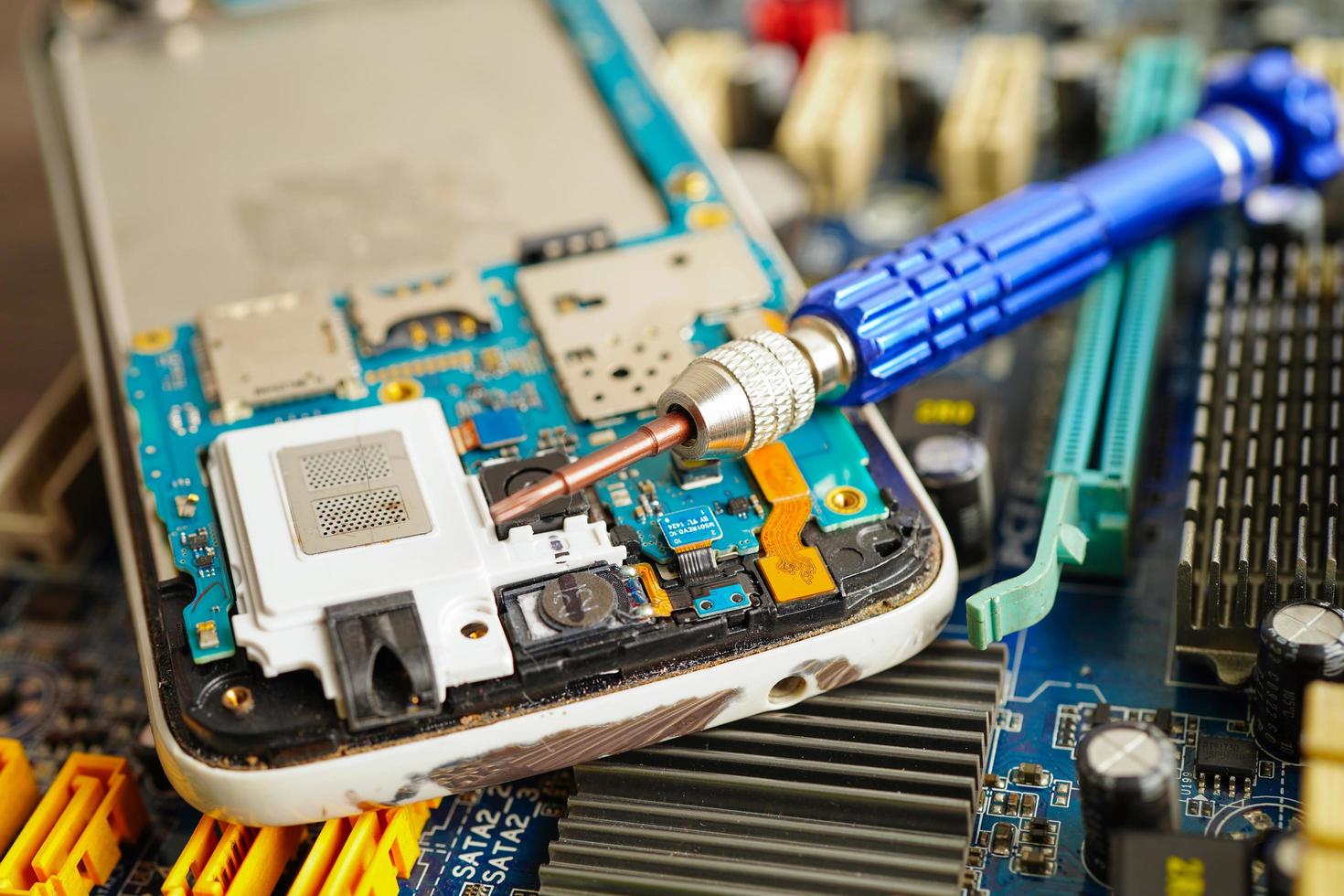 Repairing and upgrade mobile phone, electronic, computer hardware and technology concept. photo