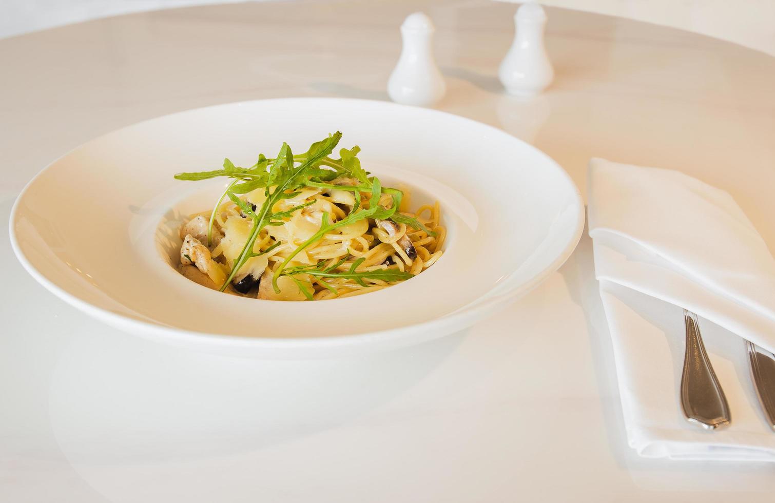 Pasta spaghetti with truffle mushroom cream sauce in white plate. photo