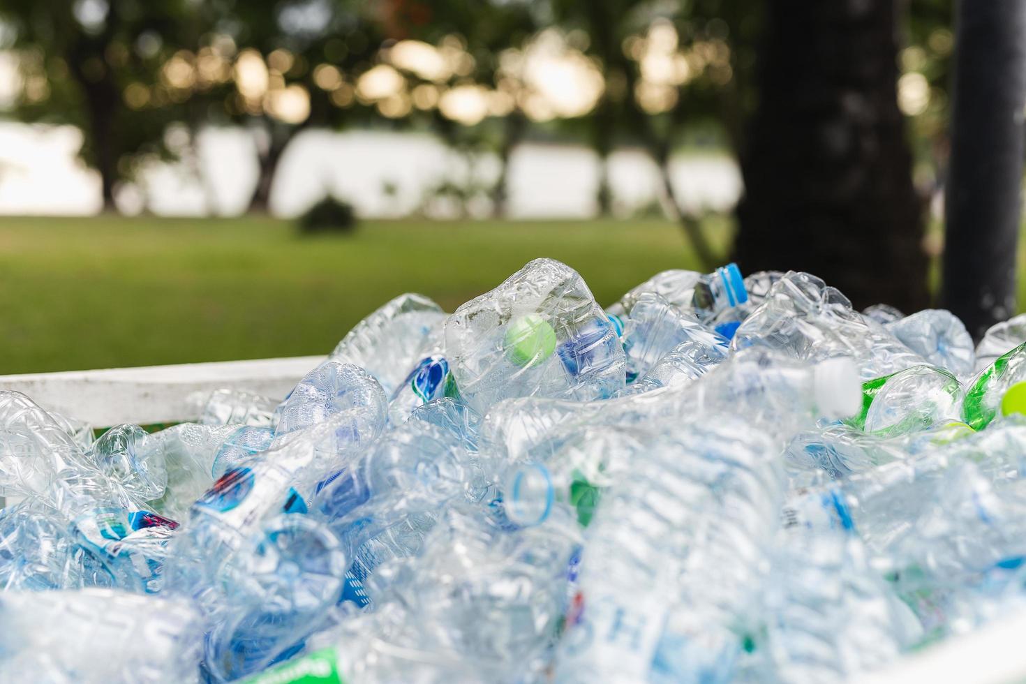Recyclable garbage of plastic bottles in rubbish bin environment conceptual. photo