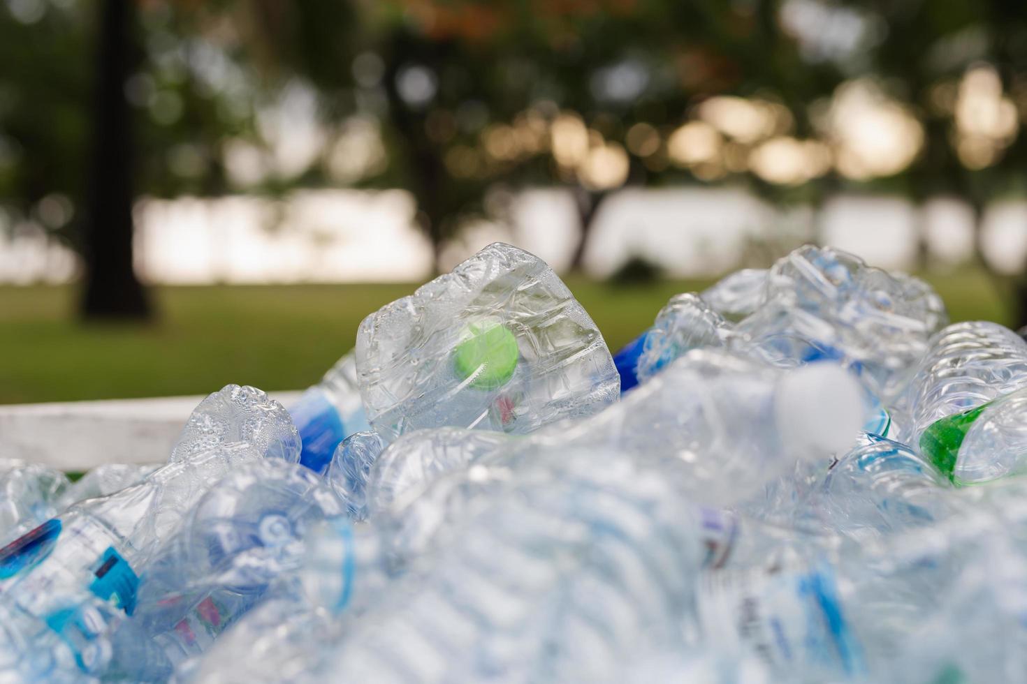 Recyclable garbage of plastic bottles in rubbish bin environment conceptual. photo