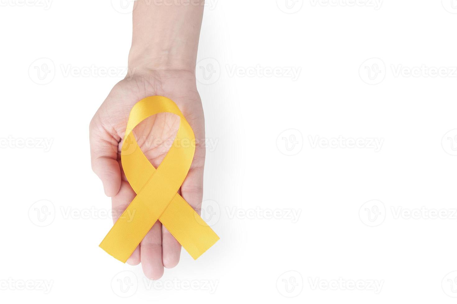 Orange satin ribbon on the palm of a woman, isolated on a white background. Cancer awareness symbol. copy space. photo
