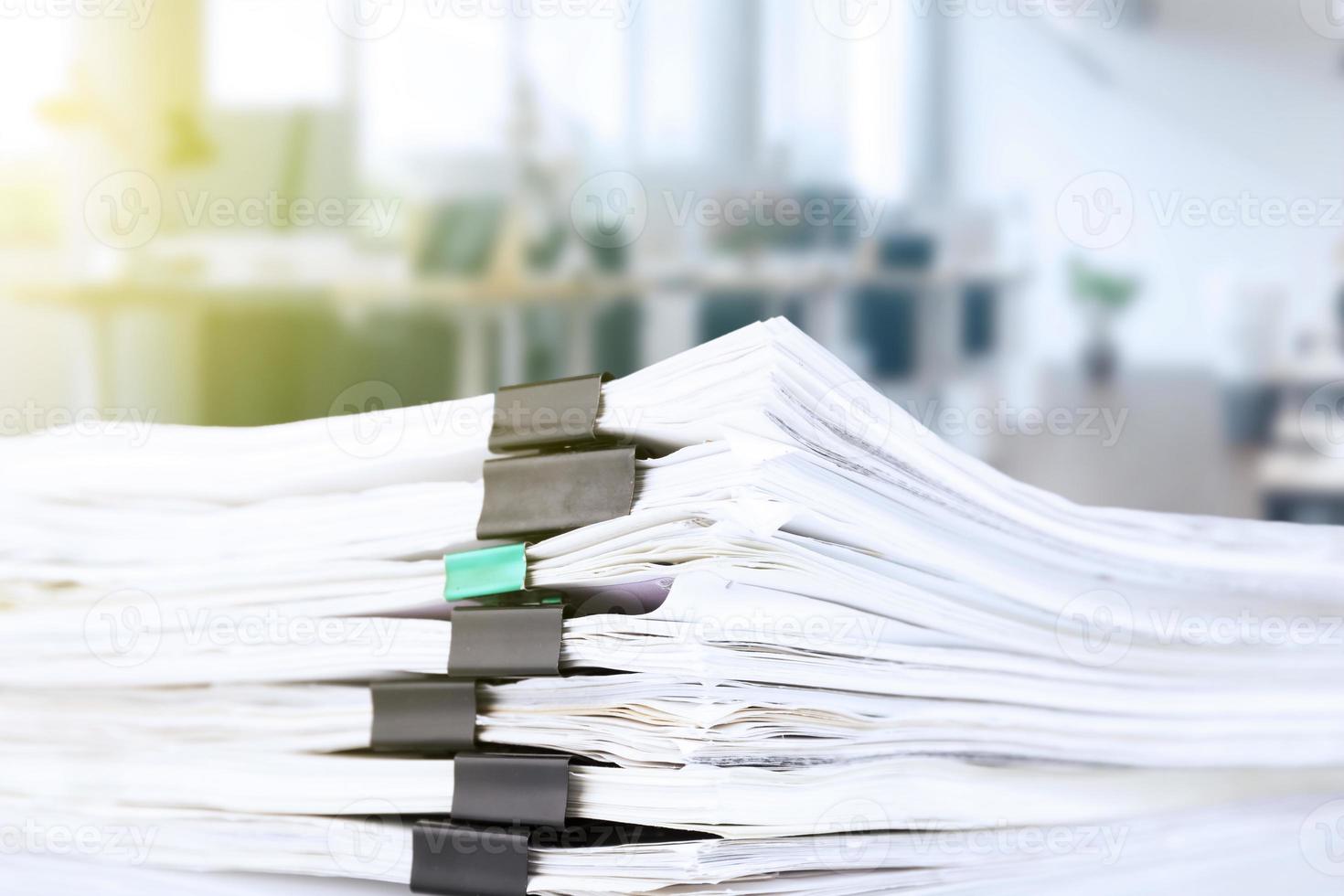 stack of reporting paper documents on a business table in the office, business documents for annual reports. Business analytics. Business office concept, soft focus. photo