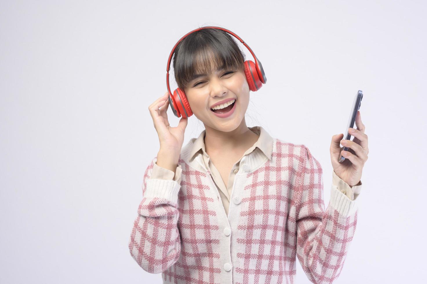 Young beautiful woman wearing headset on white background photo