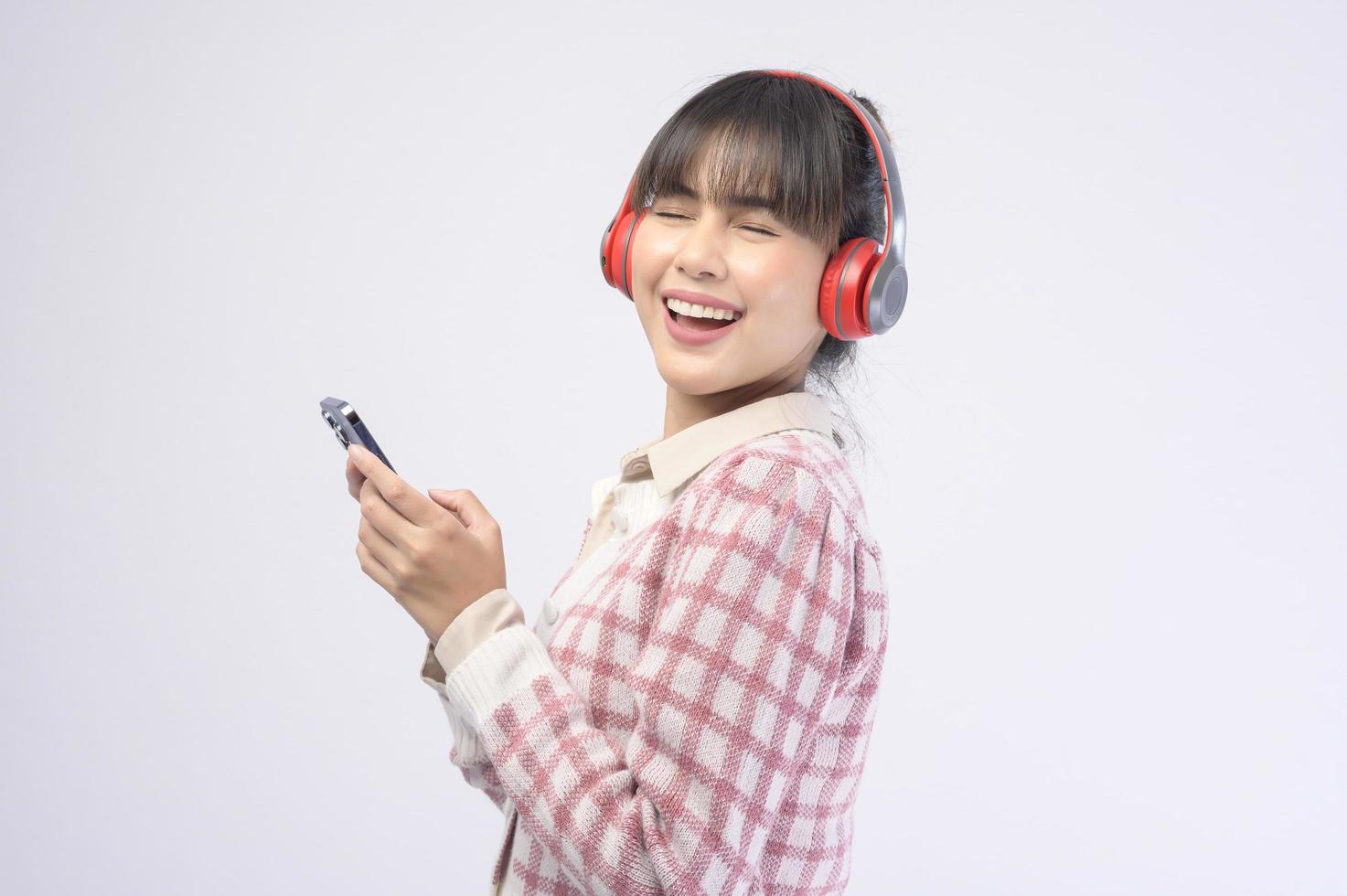 Young beautiful woman wearing headset on white background photo