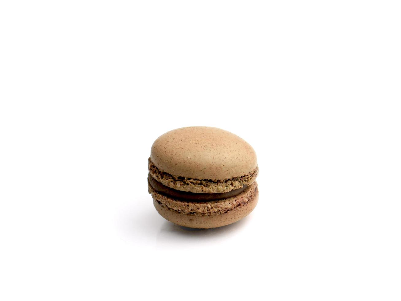 Brown chocolate French macarons macaroons cake,  delicious sweet dessert on white background, lovely food  concept. photo