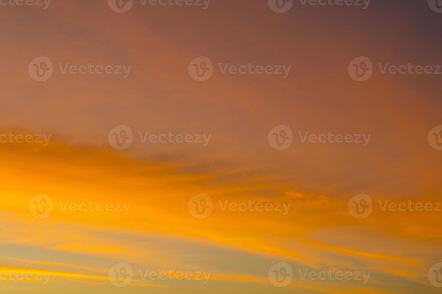 The sky is a horizontal line of yellow-orange and colorful colors in the beautiful evening in the midst of nature which is peaceful, warm and romantic in the countryside and is extremely beautiful. photo