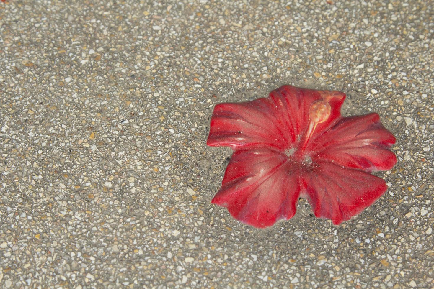 Ceramic flowers decorated in many beautiful colors on the school sidewalk make children want to go to school for a walk. photo