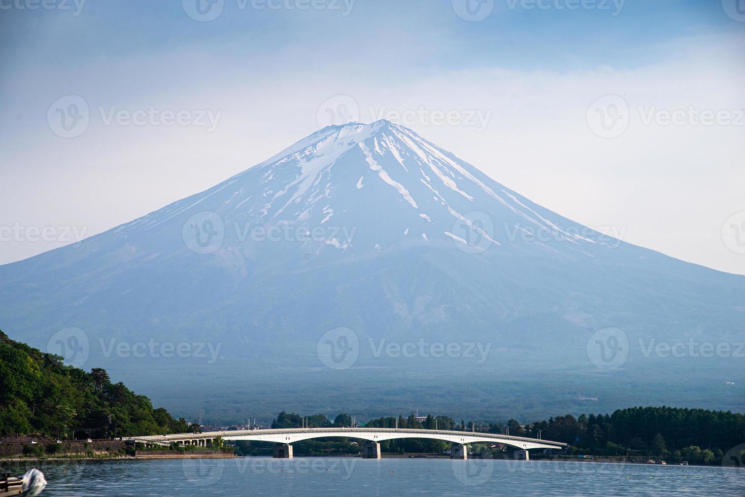 Beautiful Fuji mountain with bridge cloud and blue sky in summer, the famous landmark and attraction place of tourists who have a long holiday in Japan, Lake Kawaguchiko photo