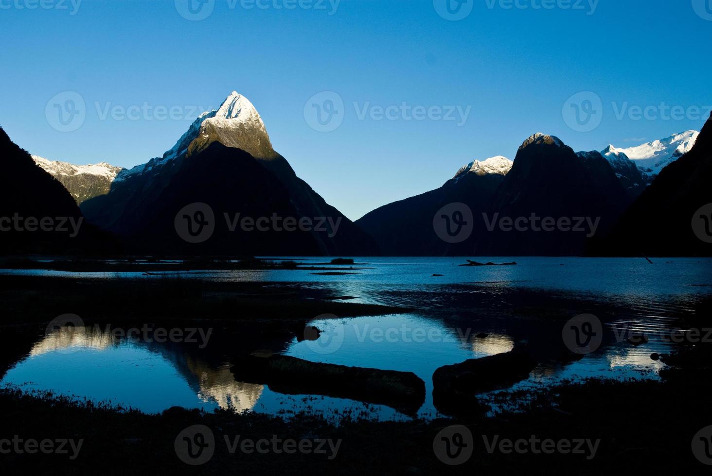 Mountain sky and sunrise at Milford Sound, New Zealand photo