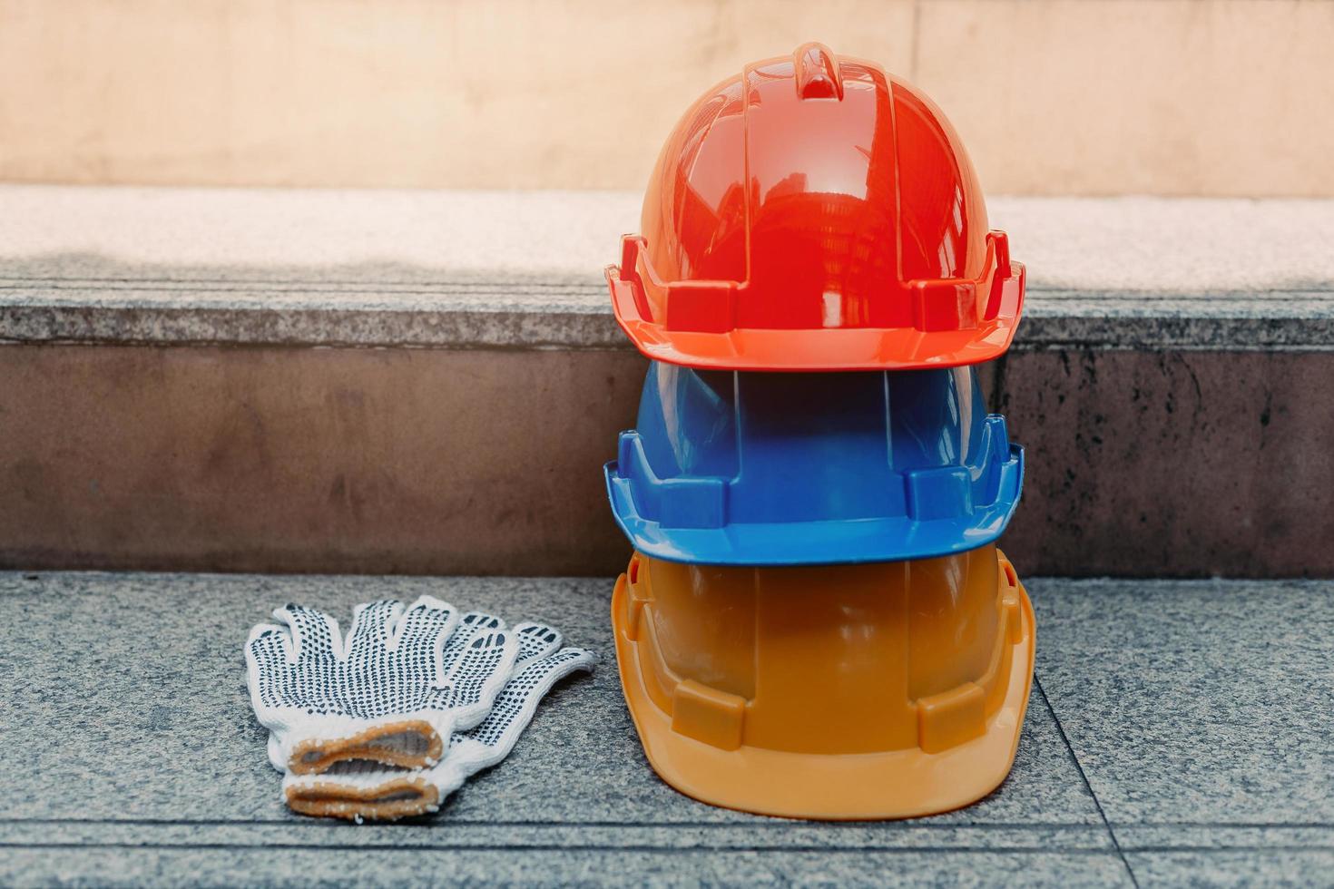 Safety helmet with gloves. Standard construction safety equipment. photo