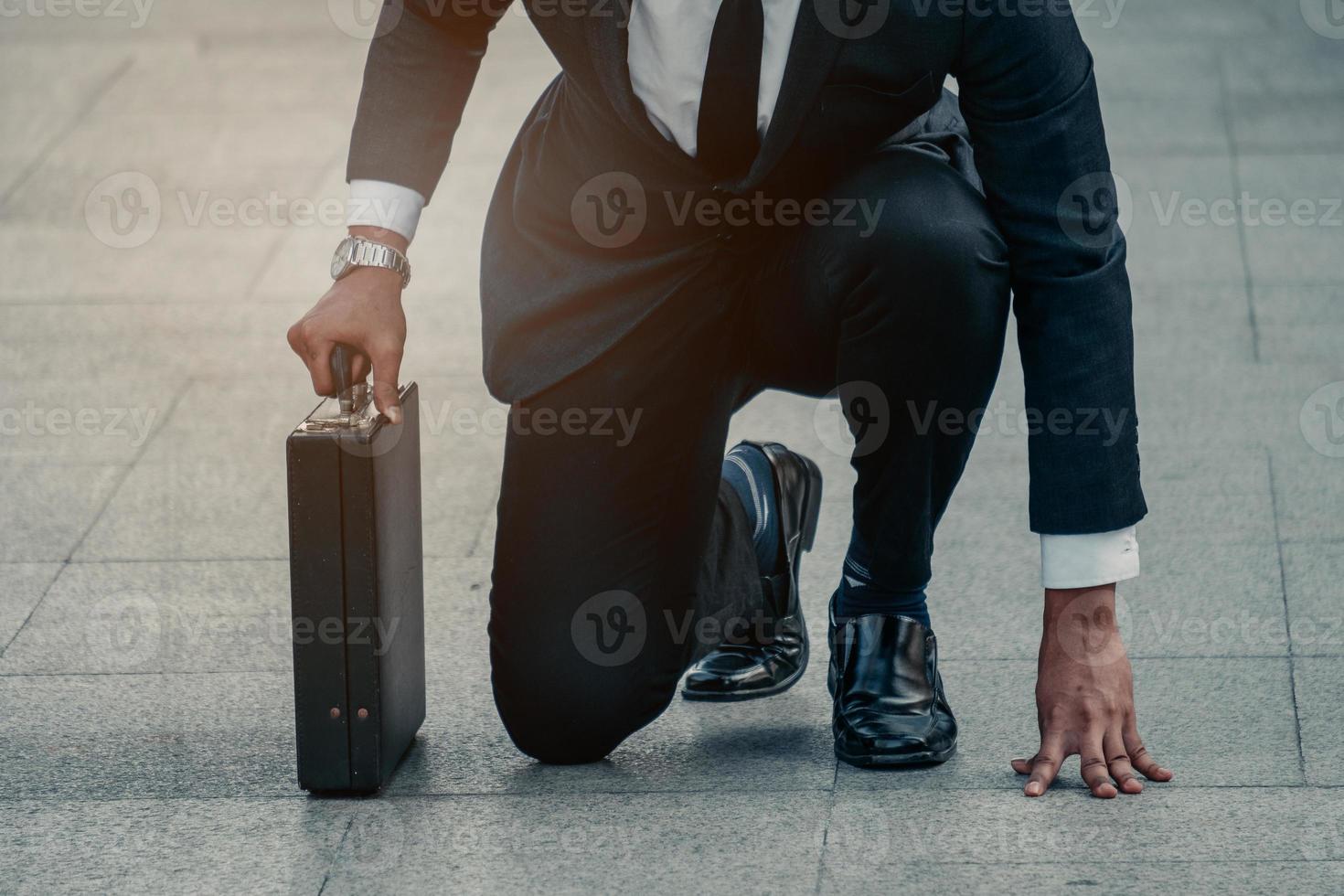 Asian businessman ready to run. Asian business person ready to run toward the city. Business opportunity concept photo