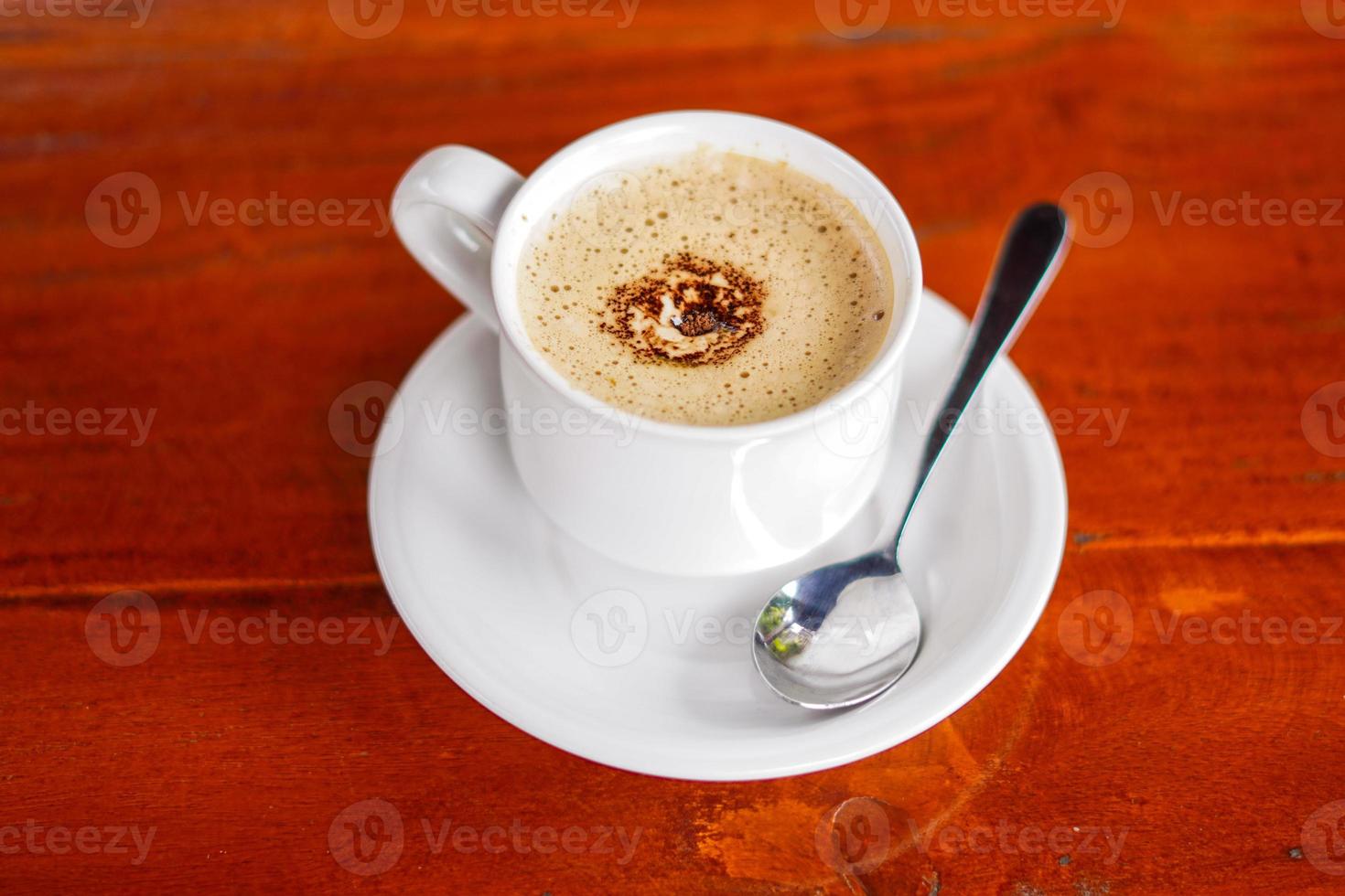 aesthetic a cup of coffee on wooden background photo