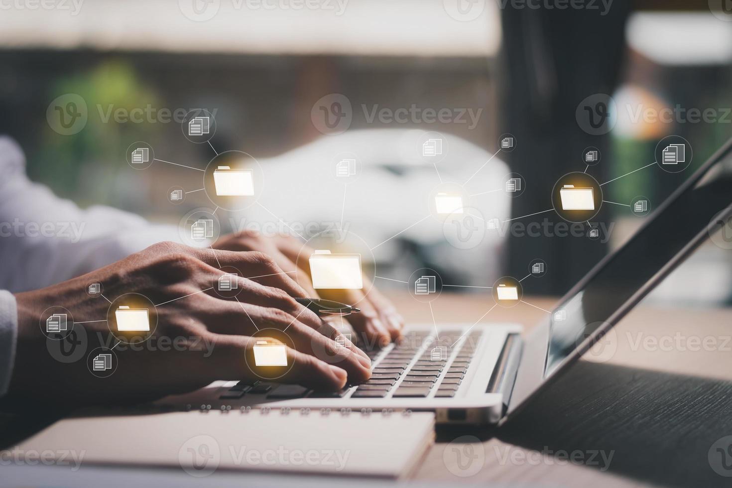 Document management system concept, business man holding folder and document icon software, searching and managing files online document database, for efficient archiving and company data. photo