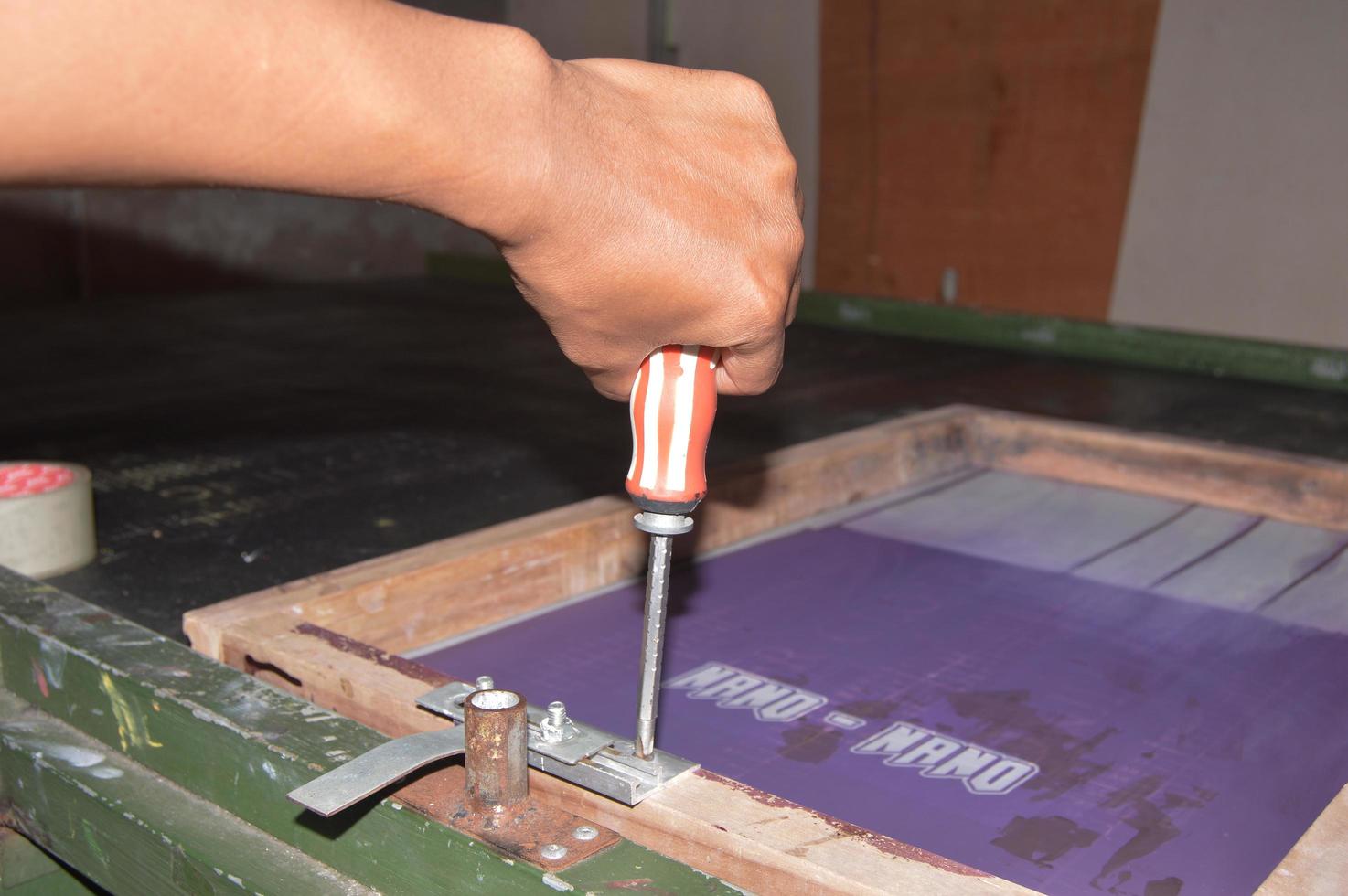 manual screen printing tool in a printing factory photo