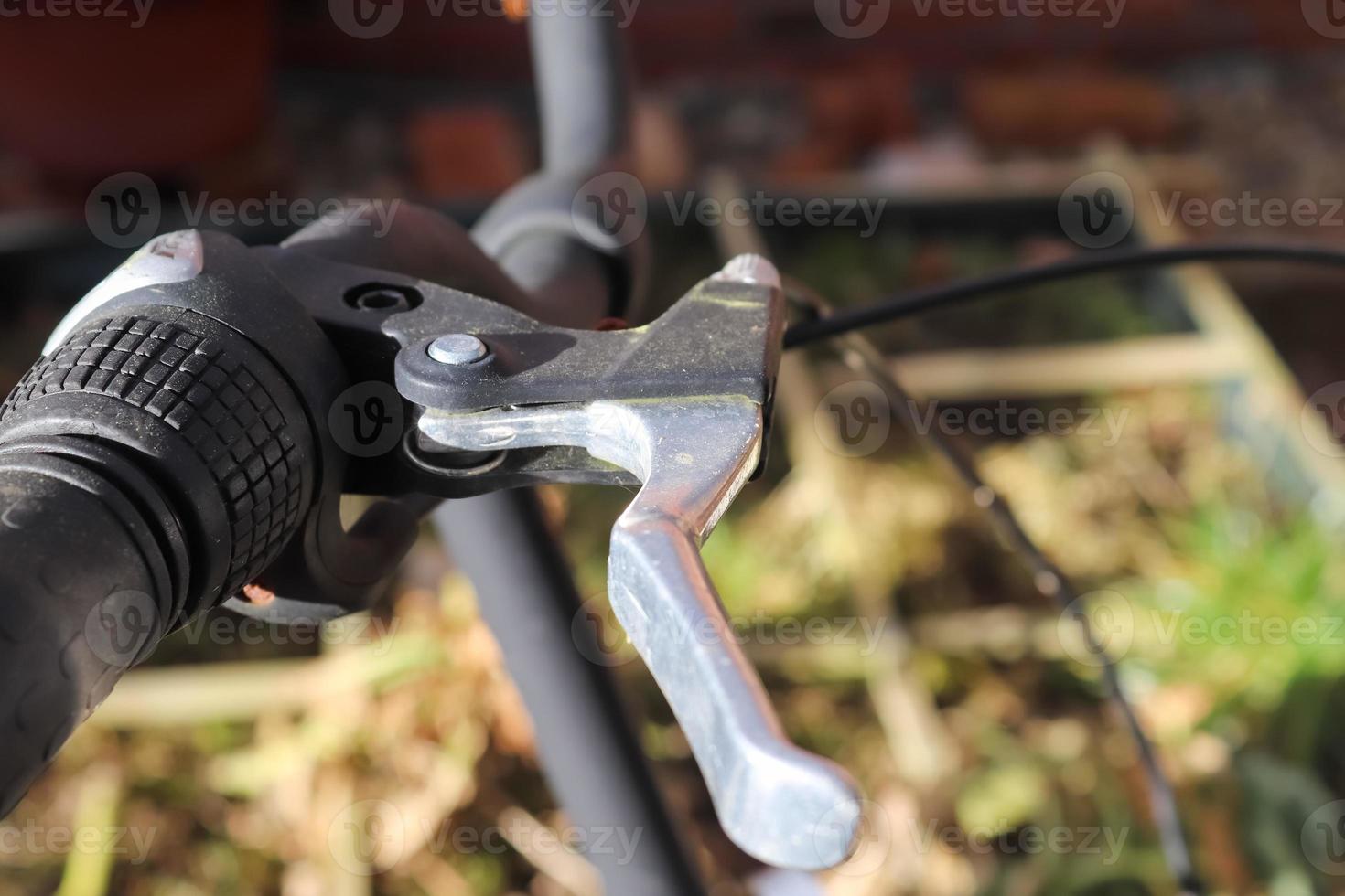 Selective focus show at the handbrake lever on a bicycle. photo