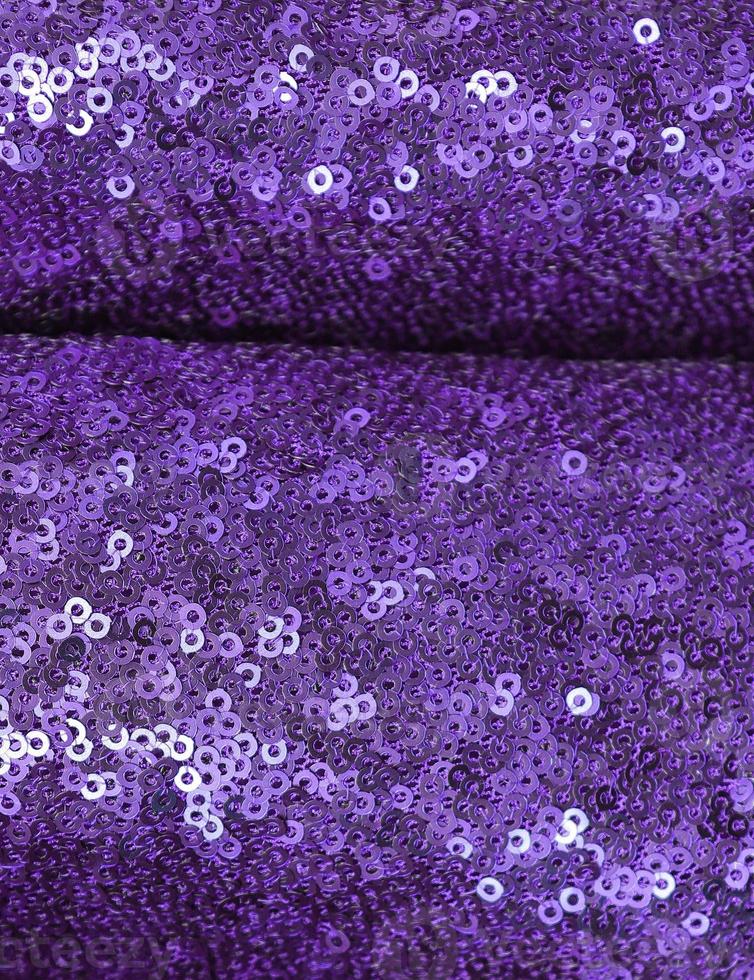 Detailed close up view on samples of cloth and fabrics in different colors found at a fabrics market photo