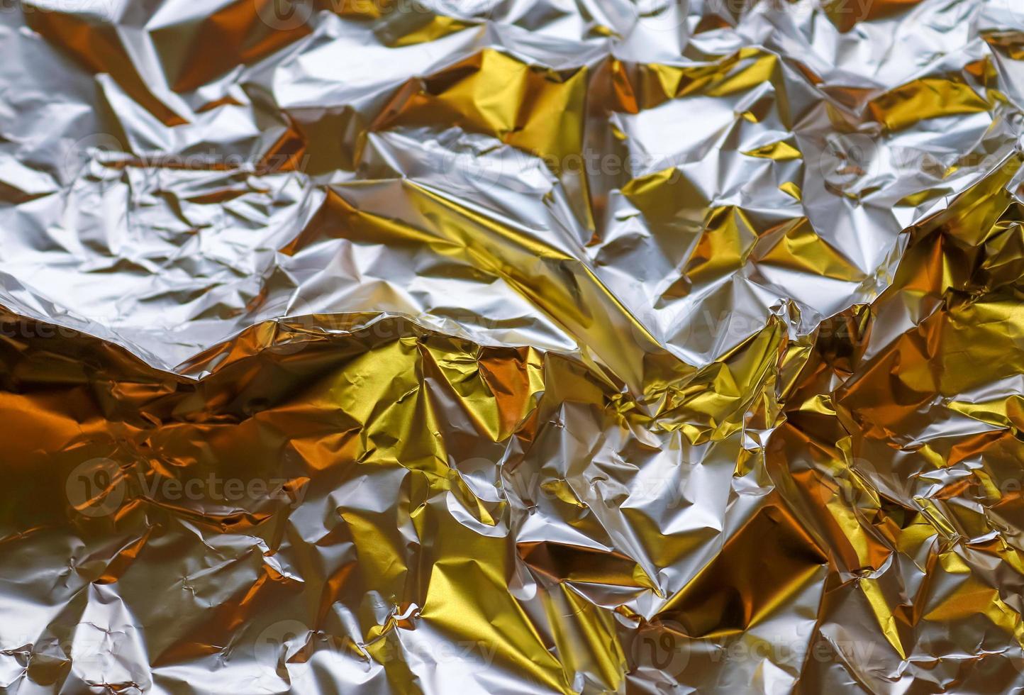 Detailed close up texture of an aluminum foil surface in different