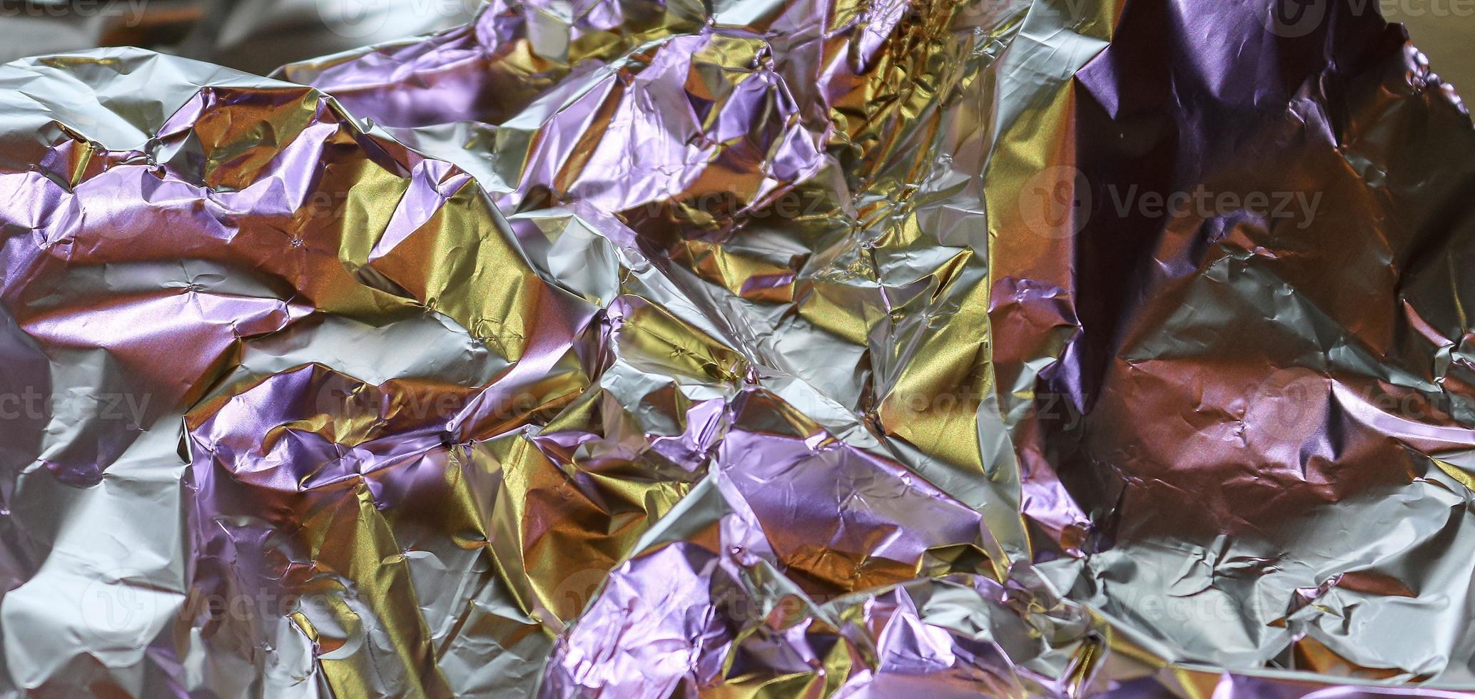 Detailed close up texture of an aluminum foil surface in different