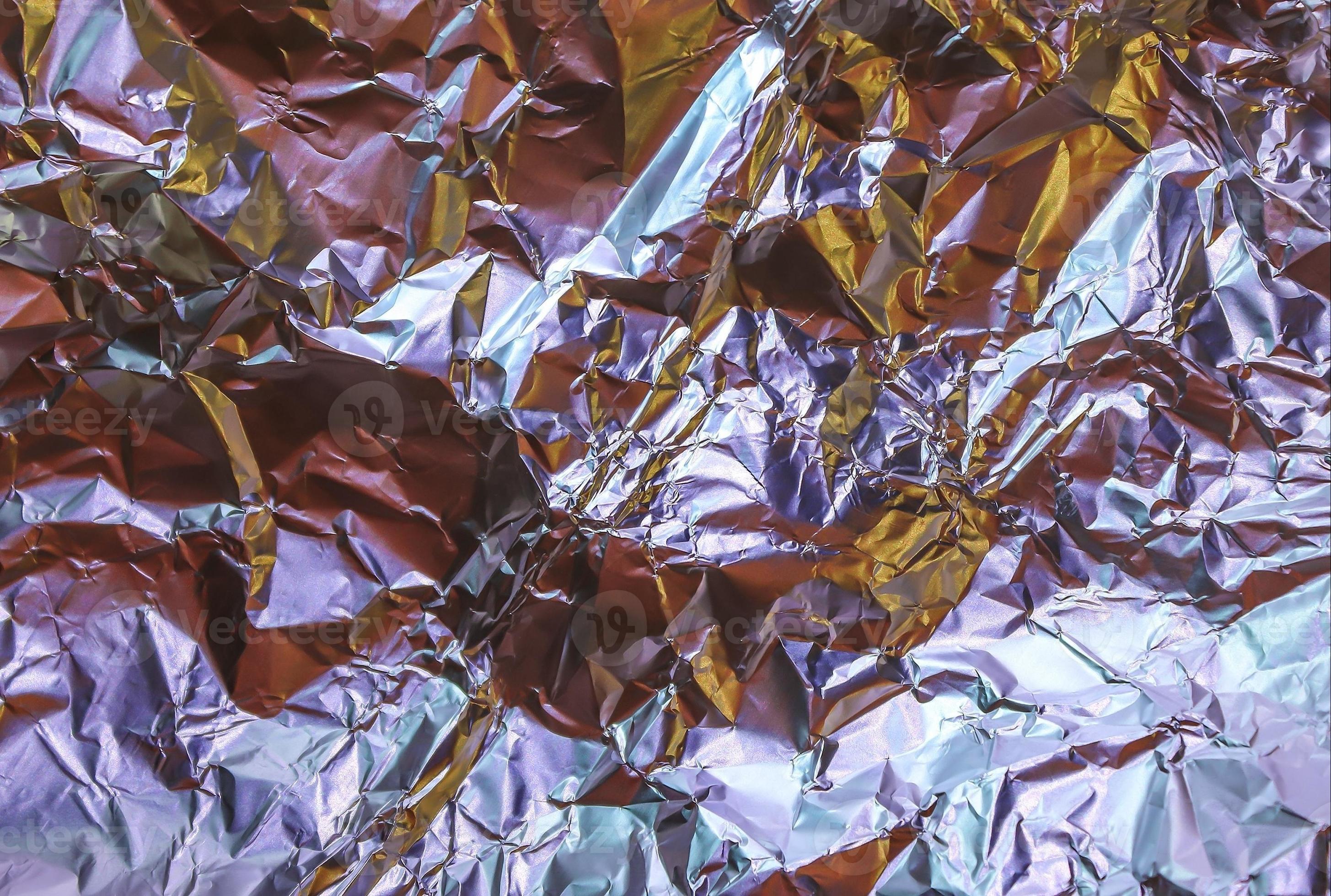 https://static.vecteezy.com/system/resources/previews/008/140/790/large_2x/detailed-close-up-texture-of-an-aluminum-foil-surface-in-different-colors-photo.JPG