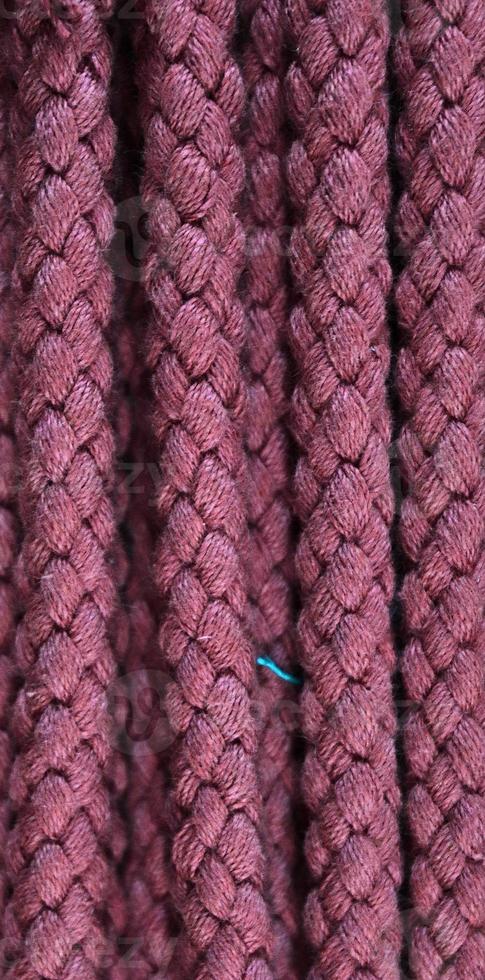 Detailed close up view on samples of cloth and fabrics in different colors found at a fabrics market photo