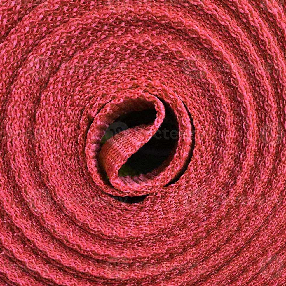 Detailed close up view on samples of cloth and fabrics in different colors found at a fabrics market photo
