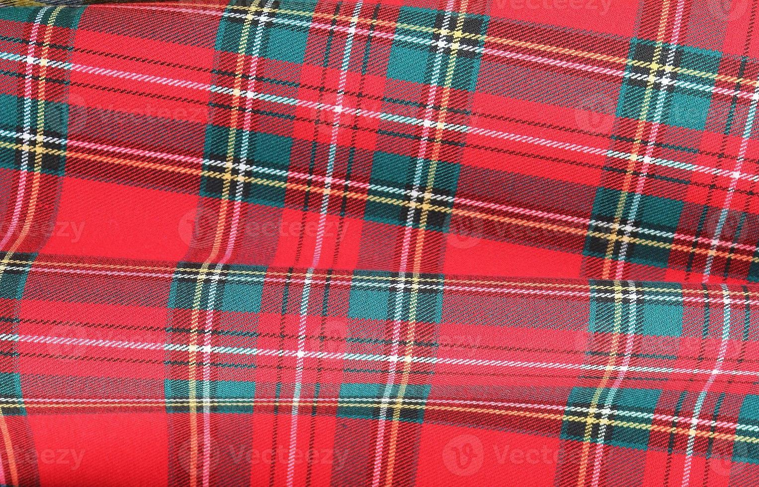 Detailed close up view on samples of cloth and fabrics in different colors found at a fabrics market photo