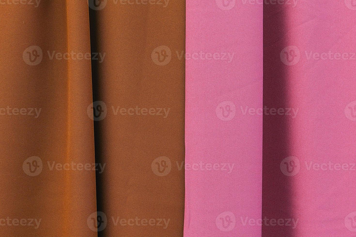 Detailed close up view on samples of cloth and fabrics in different colors found at a fabrics market photo
