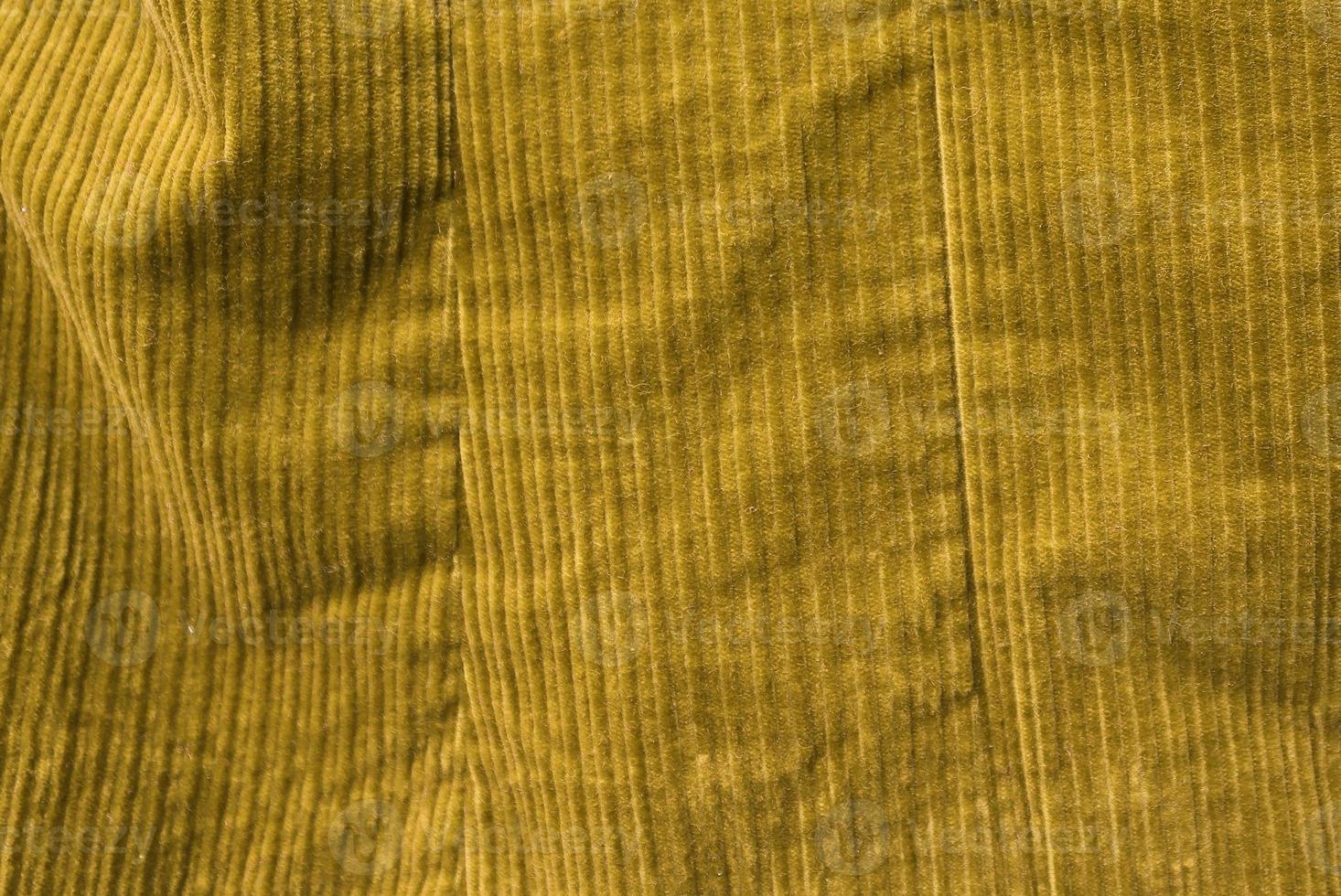 Detailed close up view on samples of cloth and fabrics in different colors found at a fabrics market photo