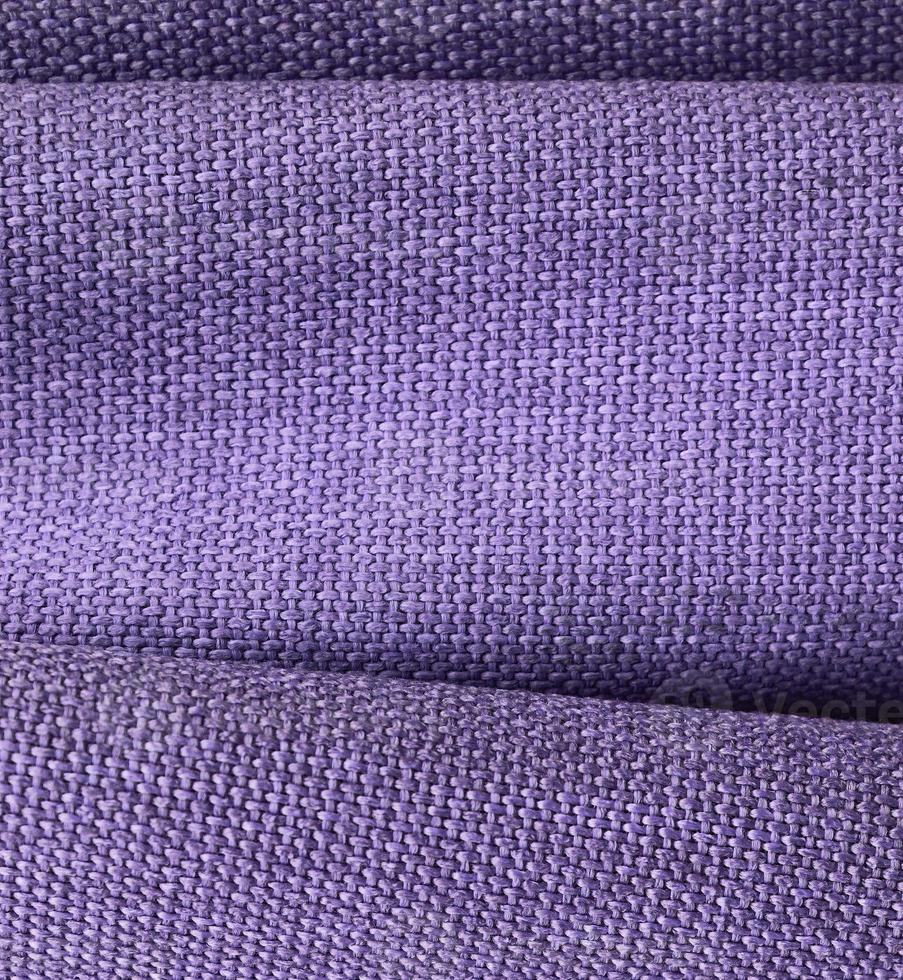 Detailed close up view on samples of cloth and fabrics in different colors found at a fabrics market photo