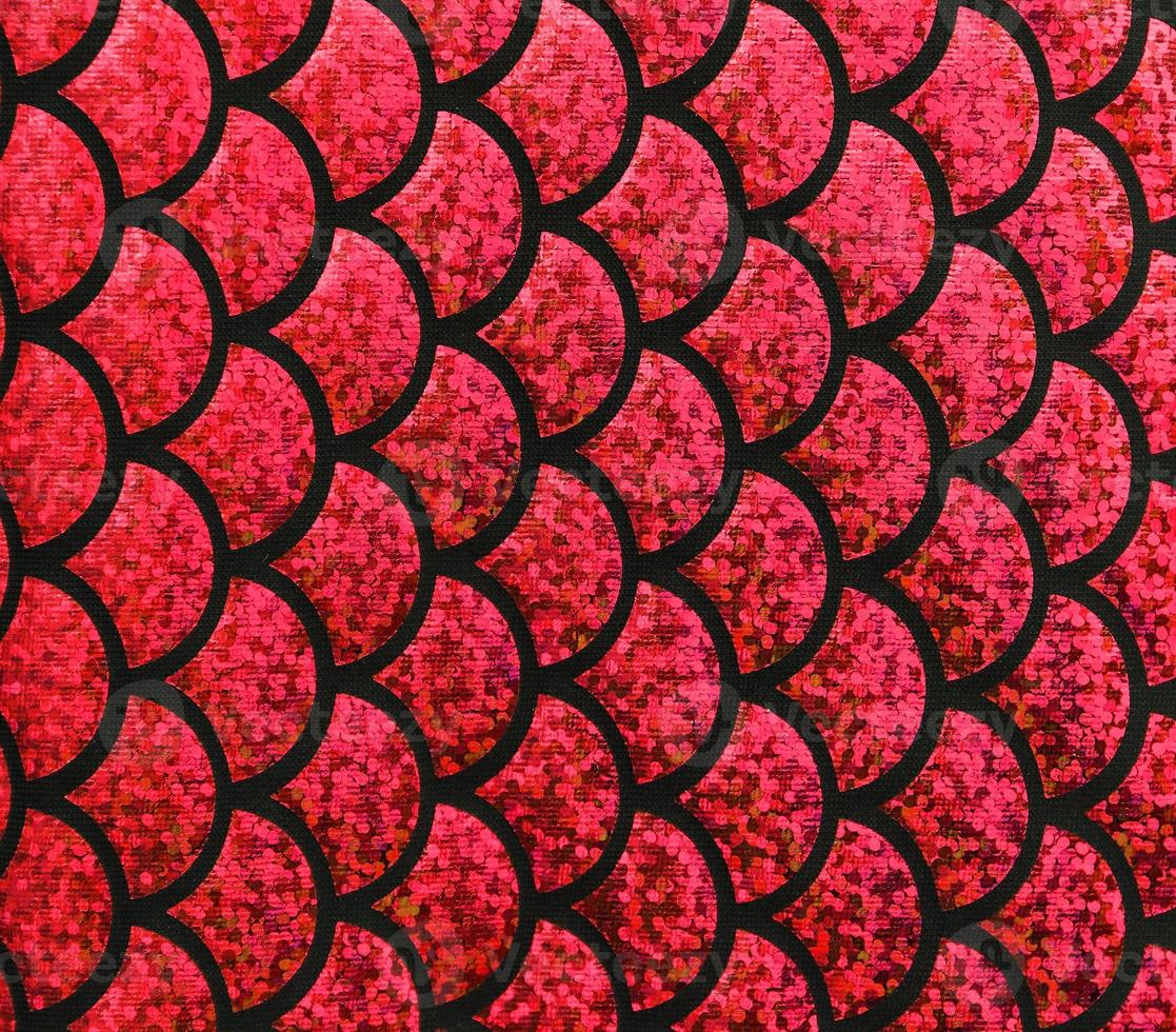 Detailed close up view on samples of cloth and fabrics in different colors found at a fabrics market photo