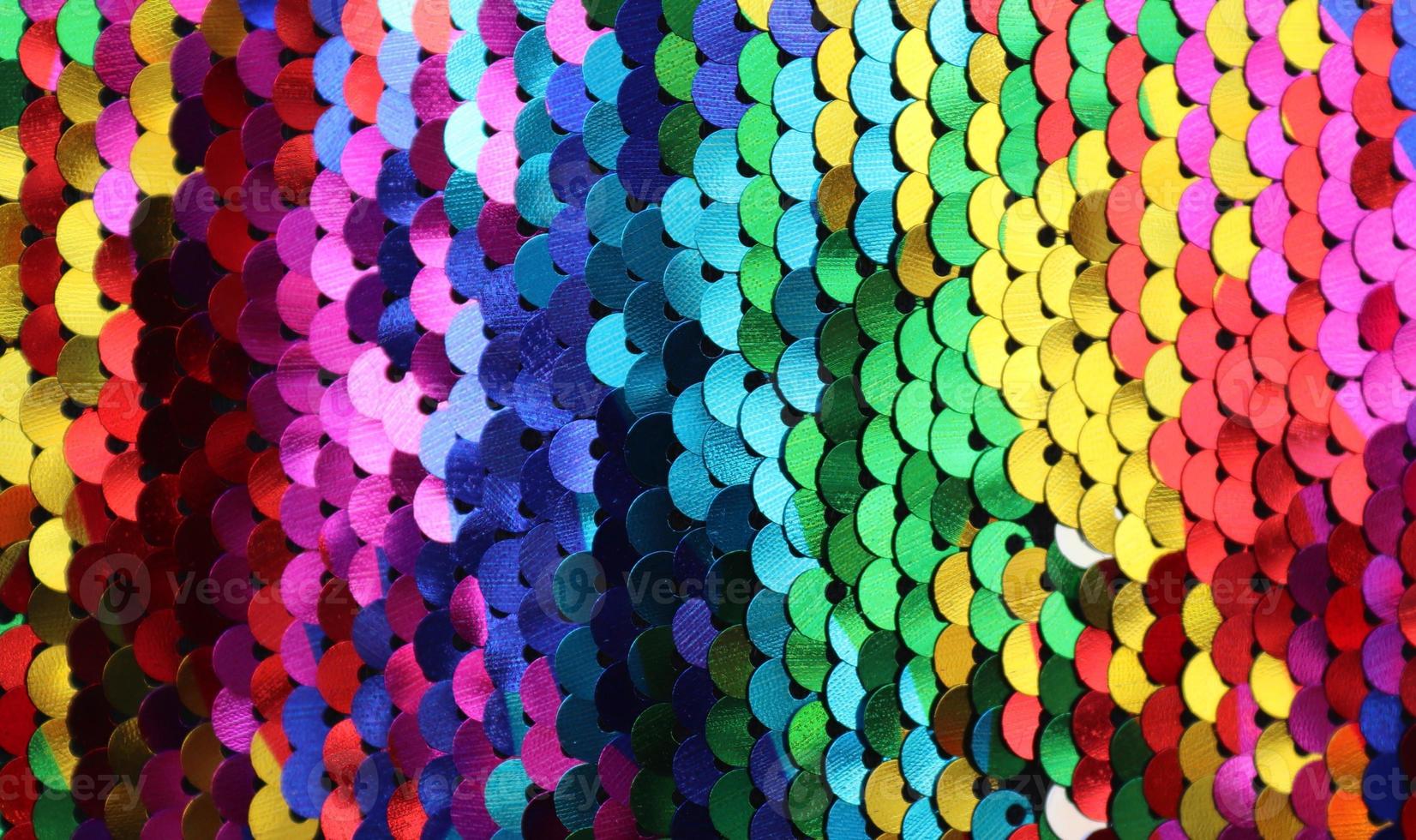 Detailed close up view on samples of cloth and fabrics in different colors found at a fabrics market photo