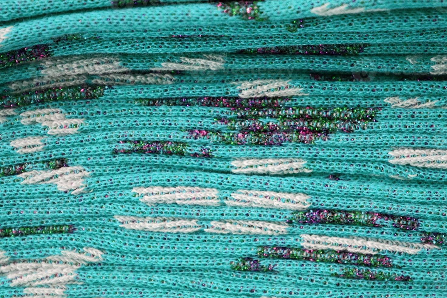 Detailed close up view on samples of cloth and fabrics in different colors found at a fabrics market photo