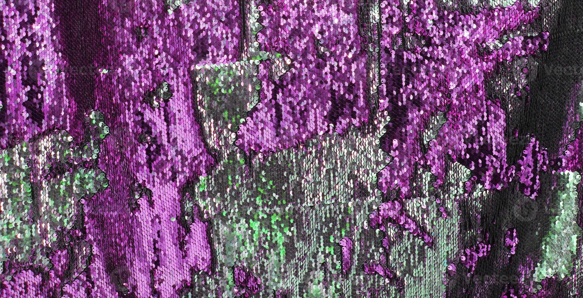 Detailed close up view on samples of cloth and fabrics in different colors found at a fabrics market photo