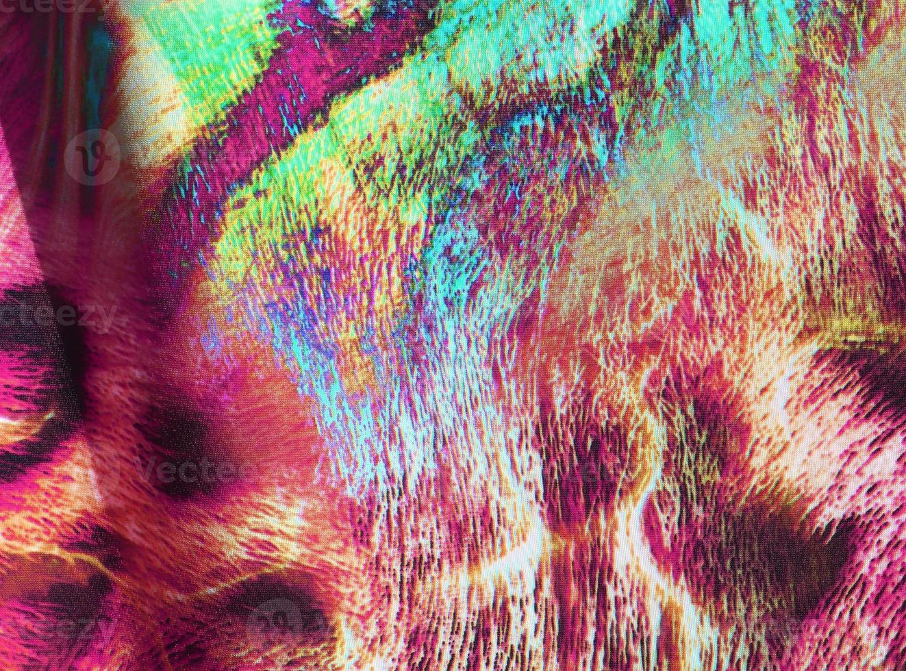 Detailed close up view on samples of cloth and fabrics in different colors found at a fabrics market photo