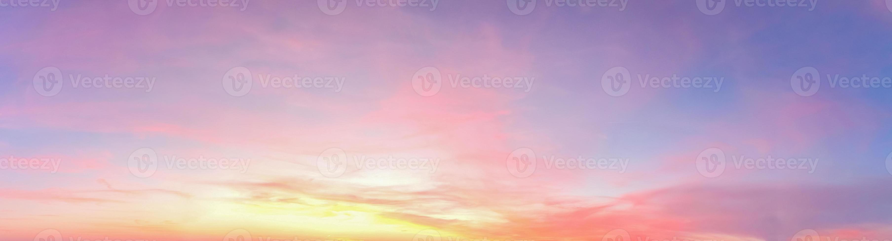 Beautiful high resolution panorama of orange and red sunset clouds in the evening sky photo
